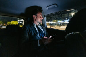 Taxicab Companies Peoria IL 2 A business man gets a ride from MC Cab, one of the top taxicab companies in Peoria IL